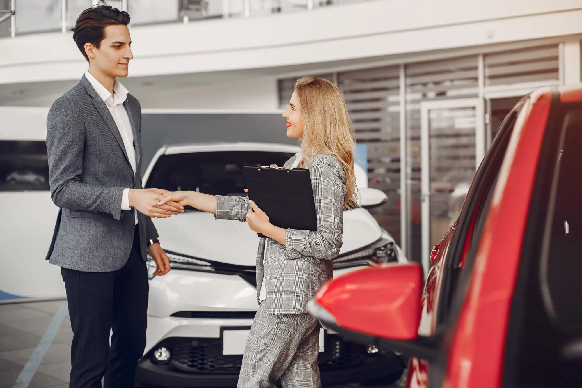 two-stylish-woman-car-salon_1157-20525