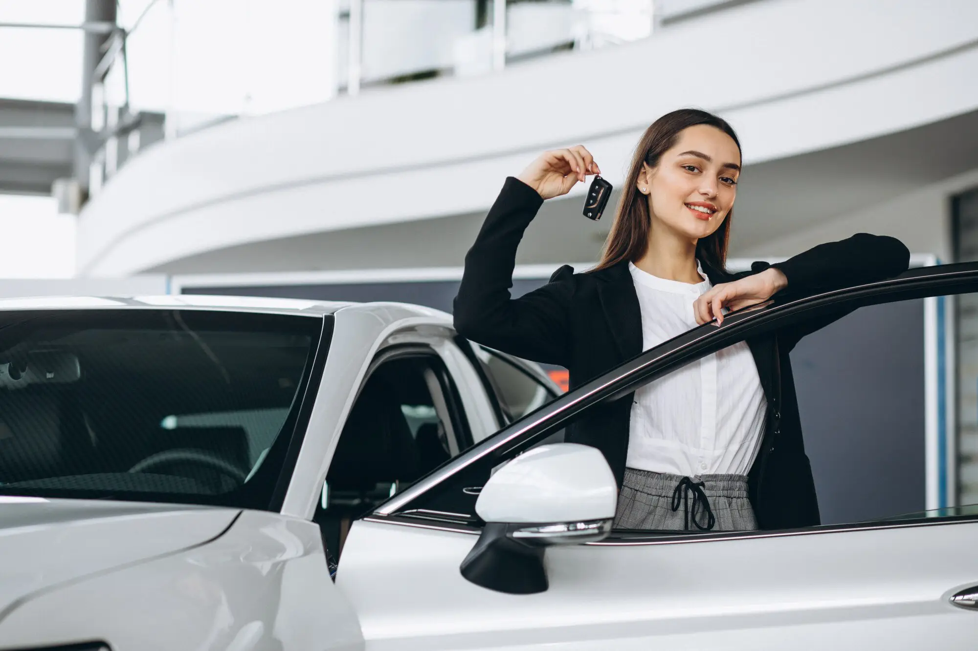 woman-choosing-car-car-showroom_1303-17166